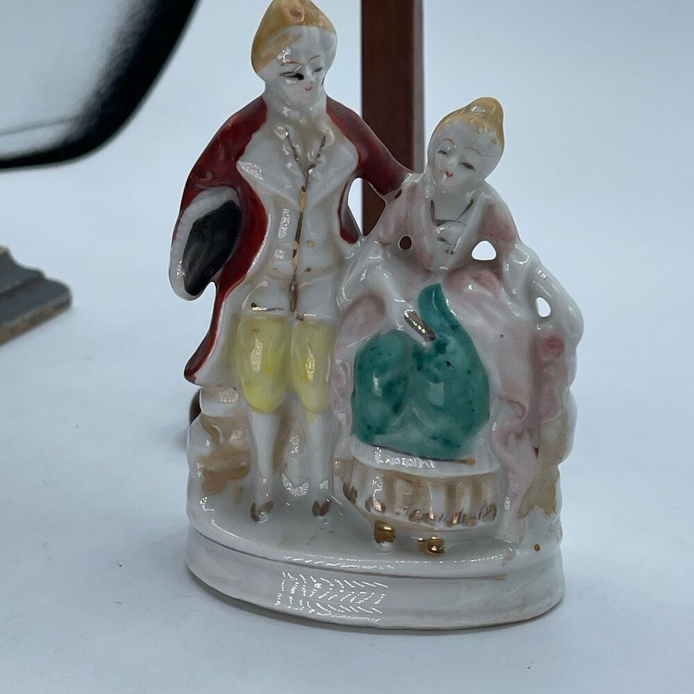 Vintage Occupied Japan bisque porcelain figurine colonial couple.
